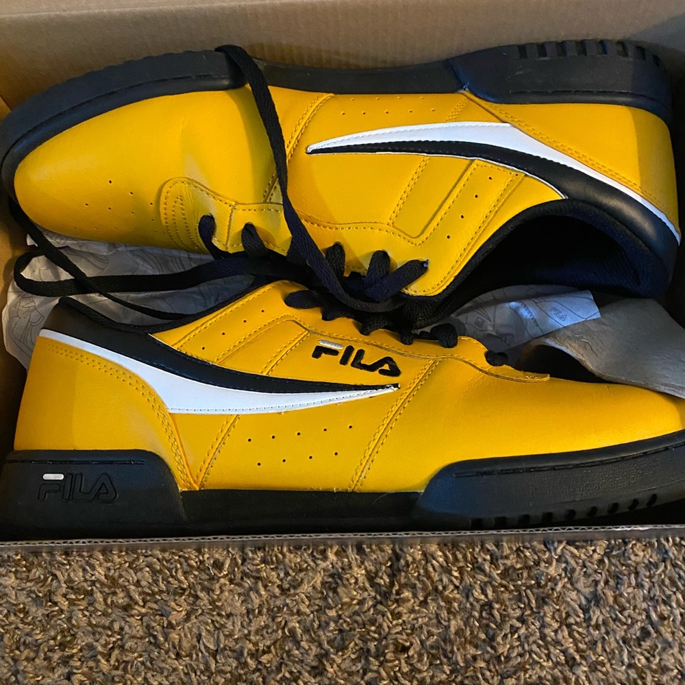 Fila. Men’s size 13, yellow and black original classics